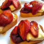 Crostini with balsamic strawberries, creamy brie, and fresh basil.