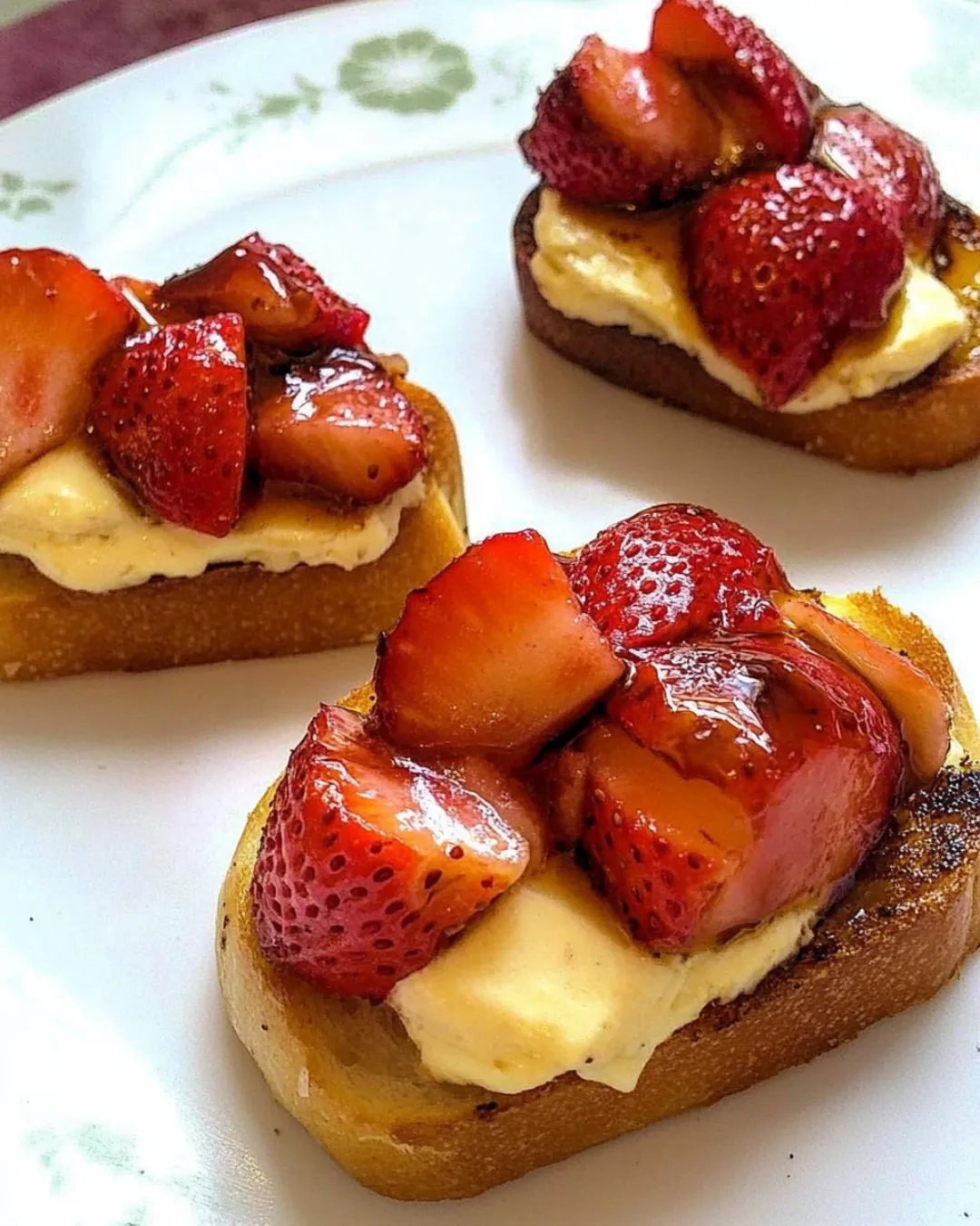 Crostini with balsamic strawberries, creamy brie, and fresh basil.