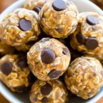 No-Bake Energy Balls made with oats, peanut butter, honey, and chocolate chips on a plate.