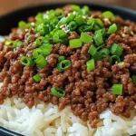 Korean Ground Beef Bowl with white rice, garnished with sesame seeds and green onions