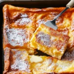 Fluffy Baked German Pancake with golden, puffy edges.