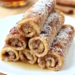 Cinnamon French Toast Roll-Ups filled with sweet cinnamon sugar and served with syrup