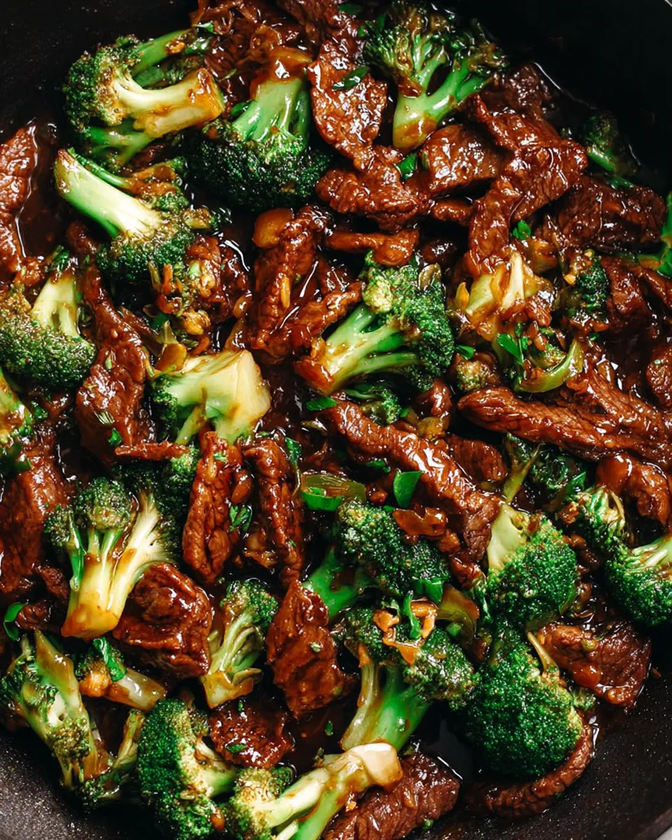 Chinese beef and broccoli stir-fry with glossy sauce served over white rice