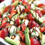 Avocado strawberry caprese salad with mozzarella, basil, and balsamic glaze