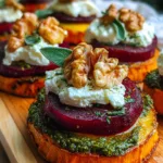 Sweet potato rounds stacked with roasted beets and burrata cheese, garnished with herbs