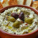 Green olive and feta cheese dip with pita