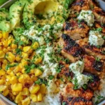 Grilled chicken bowl with Mexican street corn, avocado, and cilantro-lime rice