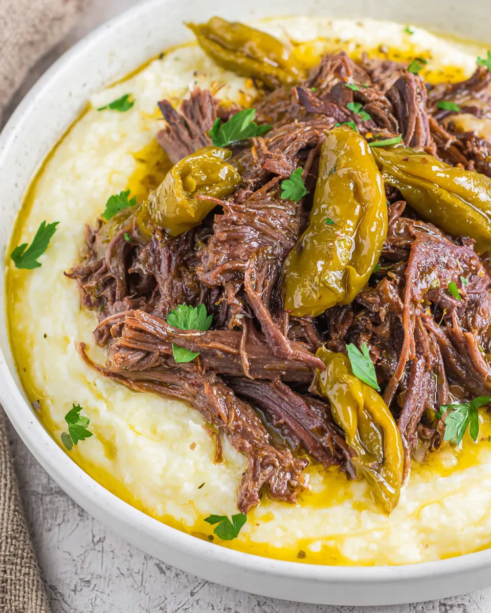 Crockpot Mississippi pot roast with pepperoncini and tender beef in a slow cooker.