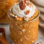 Pumpkin pie overnight oats in a mason jar with pecans