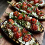 Roasted eggplant boats filled with herbed ricotta and fresh tomatoes