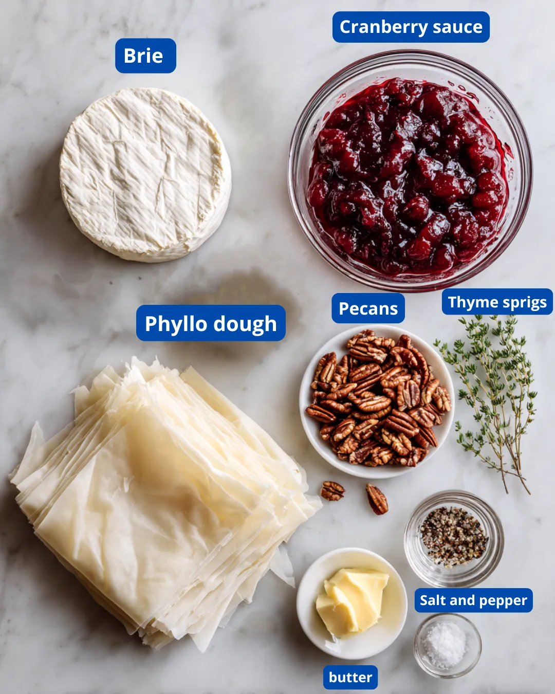 Ingredients for Festive Brie Phyllo Layers – brie, cranberry sauce, pecans, phyllo dough, butter, and thyme