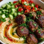 Mediterranean hummus bowl with juicy meatballs