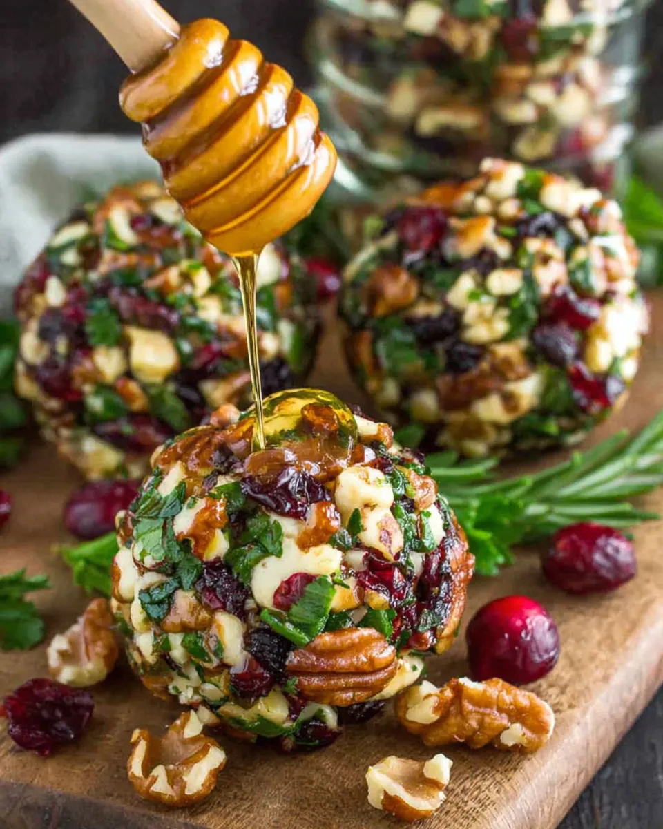 Mini Cranberry Pecan Goat Cheese Balls with cranberries, pecans, and parsley