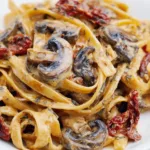 Creamy sun-dried tomato and mushroom pasta with basil